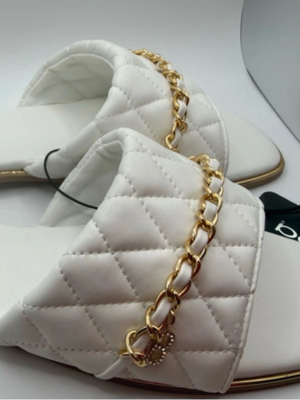 bebe White Quilted Slide Sandals with Gold Chain Accent